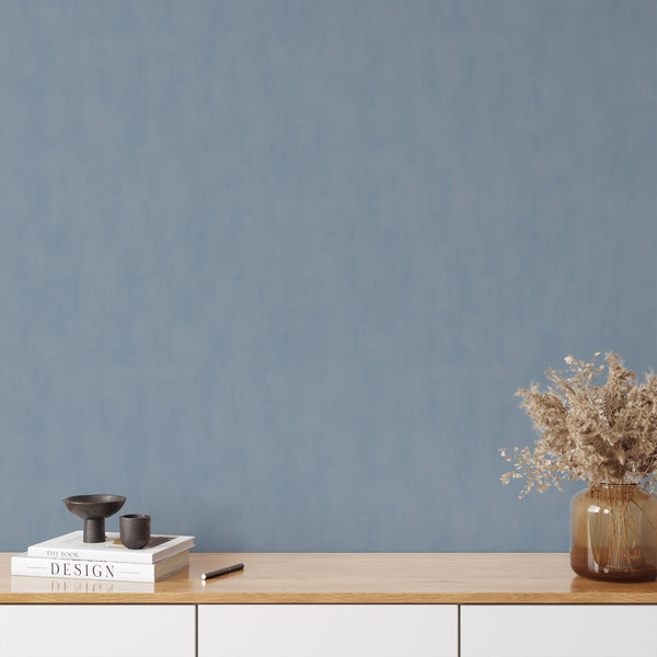 Matte plaster look wallpaper with soft mottling, perfect for those seeking a sophisticated yet understated wall covering.