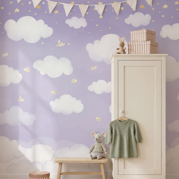 Purple sky wall mural with fluffy white watercolor clouds, scattered golden yellow stars and tiny birds for a whimsical nursery or kids bedroom.