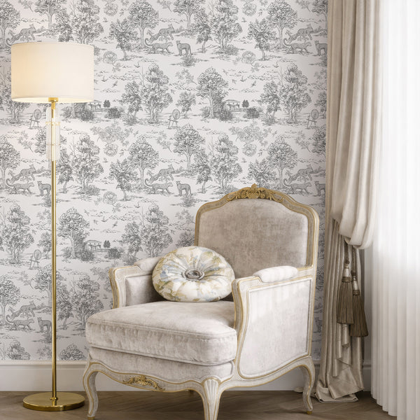 Classic toile-style wallpaper with mid-gray scenic vignettes on a smooth white background, perfect for creating a refined, timeless look in French country or eclectic spaces. The eco-friendly wallpaper's intricate details enhance the elegance of hallways or sitting rooms.