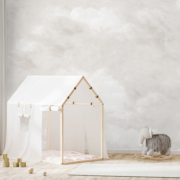 Neutral beige sky wallpaper with soft billowing clouds and subtle warm shading, creating an airy atmospheric backdrop for bedroom and nursery decor.