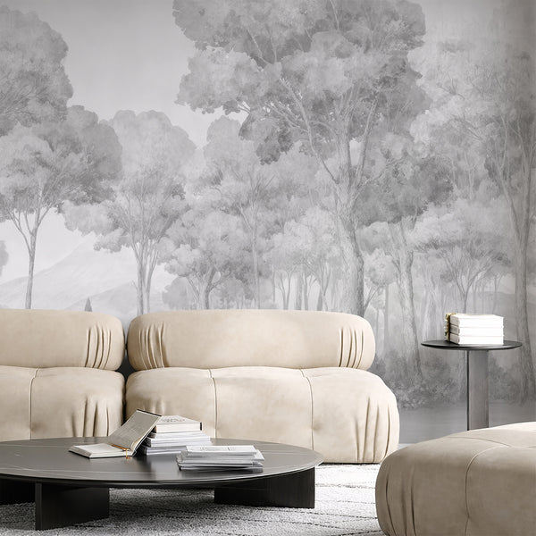 Expansive gray misty forest wall mural with tall tree silhouettes fading into atmospheric depth, creating a serene bedroom focal point. Ideal for modern wall decor, this peel and stick wallpaper uses eco-friendly materials and is easy to apply, making it perfect for renters.