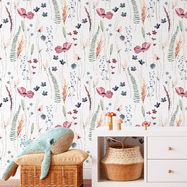 Detail of Wildflowers Wallpaper's watercolor botanical pattern featuring loosely arranged vertical clusters of flowers in soft tones on a clean white background. Ideal for a modern farmhouse living room or home office, this temporary wallpaper provides a soft matte texture and easy application.