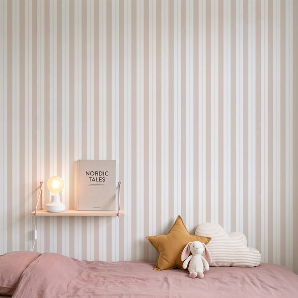 Chalky pastel stripe wallpaper with a mix of soft peach, warm cream, and beige bands. The matte finish provides a cozy, classic feel, perfect for small spaces like powder rooms. This pre-pasted wallpaper is eco-friendly and made in the USA, ideal for renters seeking sophisticated decor.