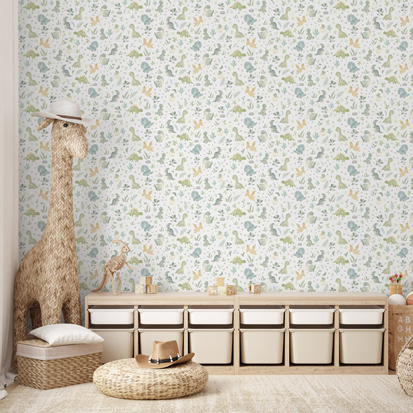 Sweet dinosaur nursery wallpaper with watercolor figures and delicate botanical accents, perfect for a Scandinavian style playroom. The evenly textured repeat is available in removable peel and stick options for easy decor updates.
