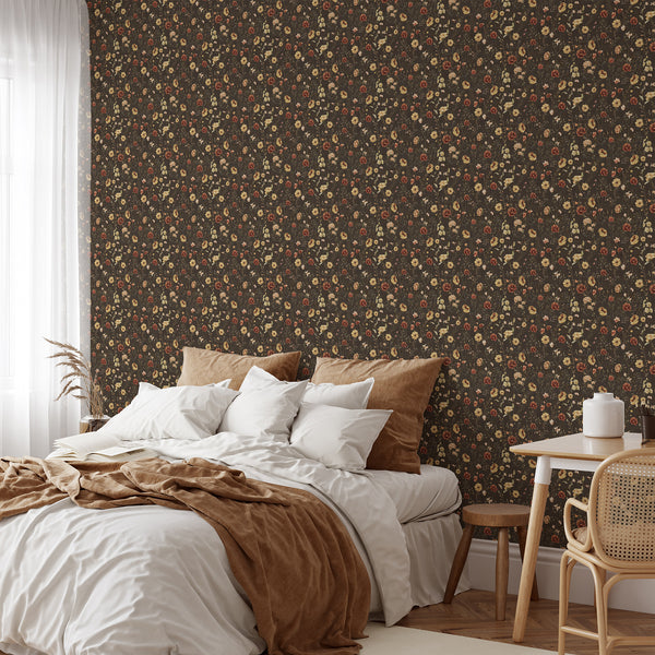 Moody floral wallpaper featuring delicate wildflowers in warm rust, soft yellow, ivory, and muted green over a dark brown backdrop for farmhouse interiors.