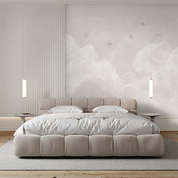 Watercolor beige wall mural with dreamy layered clouds and small birds across a warm neutral sky, perfect for minimalist nursery and kids room decor.