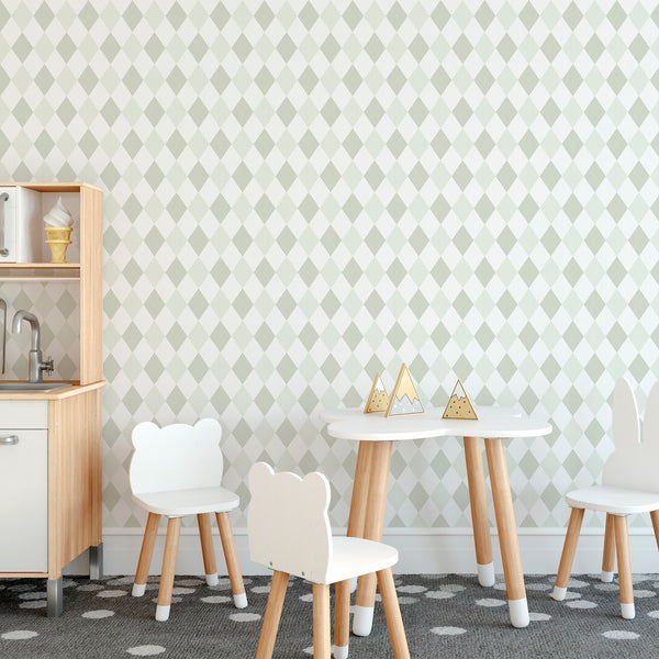 A children's playroom corner featuring a sage green and white diamond-patterned wallpaper, a small white table with two white chairs and kitchen cabinet. Perfect for modern Scandinavian interiors. Self-adhesive and easy to reposition, ideal for renters and decorators.