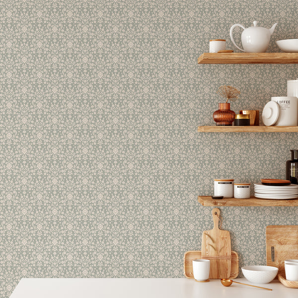 Vintage botanical damask wallpaper with ivory blossoms and scrolling leafy branches against a soft sage green background for cottagecore bedroom decor.