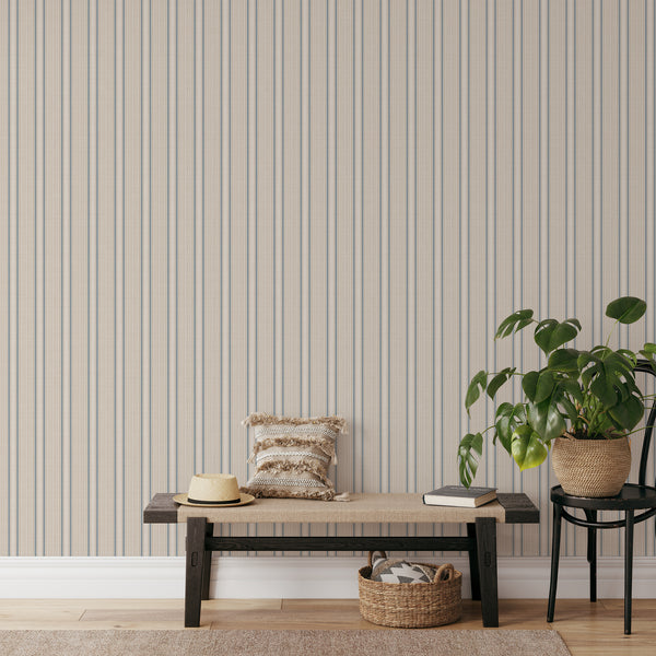 Farmhouse striped wallpaper with narrow blue vertical lines and warm beige woven-style stripes, bringing vintage country charm to bedroom accent walls.