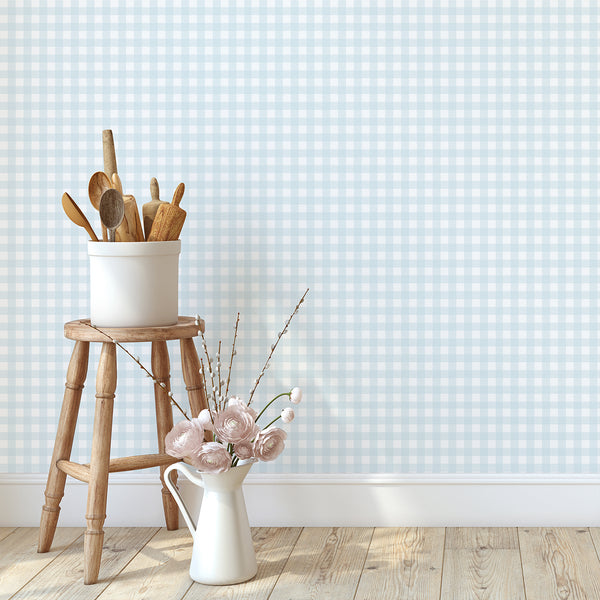 Soft blue plaid wallpaper with alternating solid and striped checks, creating a timeless preppy look for nurseries, bedrooms, and playrooms.