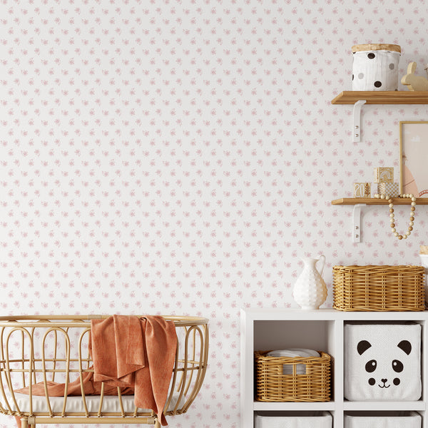 Soft pink wallpaper with delicate repeating floral illustrations and an airy white background, perfect for a girls bedroom, nursery or cottagecore interior.