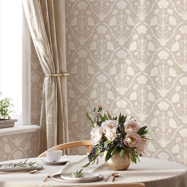 Vintage floral wallpaper in tonal beige, featuring scrolling motifs and stylized flowers, perfect for dining spaces. The classic look and soft shading strokes add understated elegance to traditional interiors.