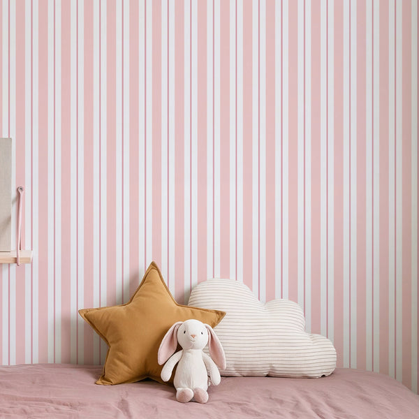 Pink Vertical Stripes wallpaper featuring muted blush pink, soft rose, and pale off-white stripes with subtle edge shading for depth, ideal for a serene nursery or home office.