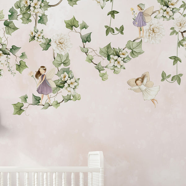 Close-up of fairy figures and hanging vines in muted sage and cream tones, perfect for a child's bedroom or playroom. This eco-friendly, removable wallpaper is easy to apply, reposition, and made in the USA.