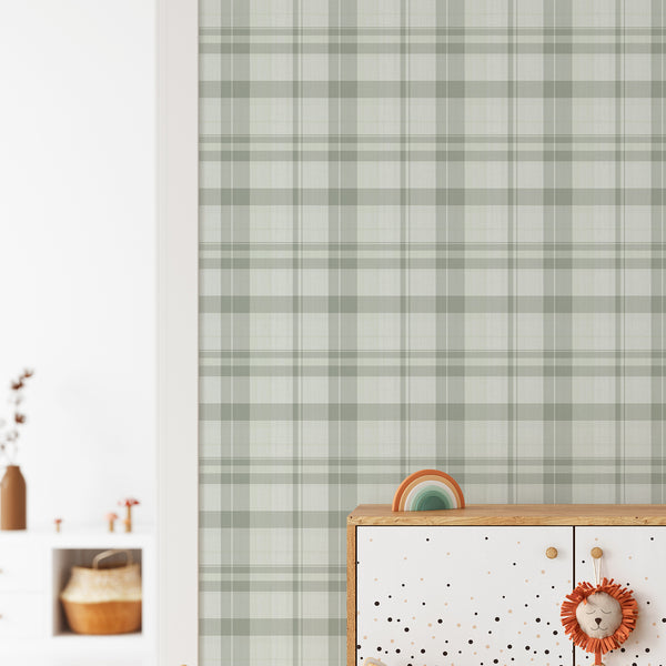 Close-up of Green Plaid Farmhouse wallpaper showcasing gentle sage and celadon tones in a plaid grid. Perfect for modern traditional spaces, this eco-friendly wallpaper offers a timeless, neutral style.