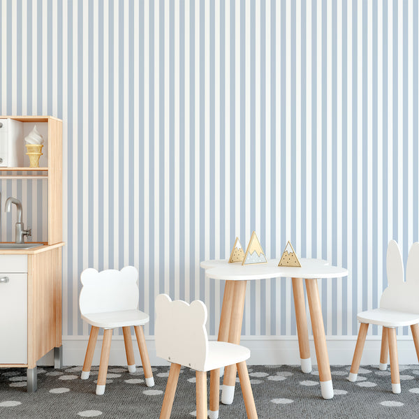 Vertical light blue stripes on a soft white ground provide a clean, modern look for accent walls in kids playroom. Easy to reposition and perfect for designers.