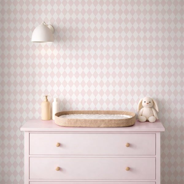 Subtle pastel pink rhombus wallpaper with small lozenges creating a soft geometric texture. Ideal for nurseries or kids' bedrooms, this removable peel and stick wallpaper offers an airy, non-intrusive pattern perfect for accent walls.