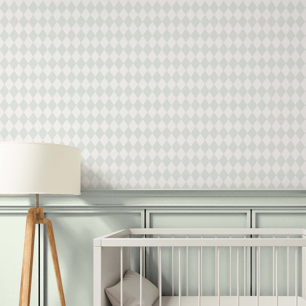 Soft geometric wallpaper with pastel green and off-white rhombus pattern, perfect for adding a tailored look to a bedroom or hallway. This temporary, self-adhesive wallpaper is made in the USA, offering a high-quality, removable option for decorators and designers. Its subtle design is ideal for creating a gentle nursery backdrop.