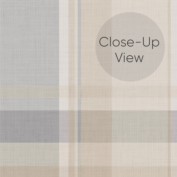 Close up of cottagecore plaid peel and stick wallpaper in muted dusty blue and beige with a classic tartan pattern, perfect for a charming bedroom accent wall.