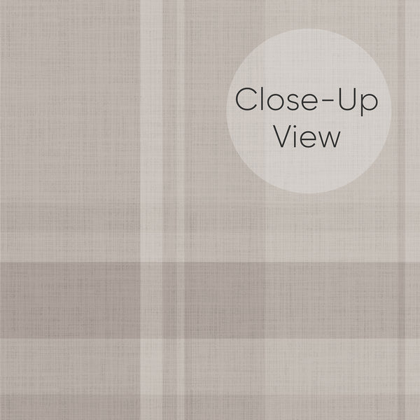 Close up of cottagecore plaid peel and stick wallpaper in muted taupe and beige with a classic tartan pattern, perfect for a cozy neutral bedroom accent wall.
