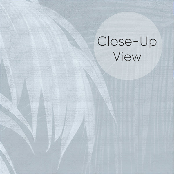 Close up of soft blue botanical wallpaper with elegant palm trees, feathery fronds and subtle layered tropical foliage on a light blue background.