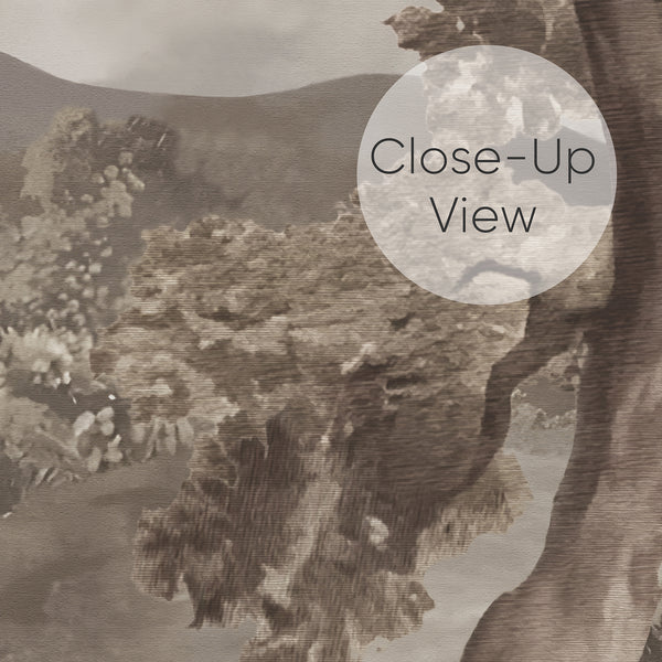 Close up of scenic landscape wallpaper with soft sepia mountains, lush trees and floral shrubs brings a calm vintage mood to a bedroom, office or living room.