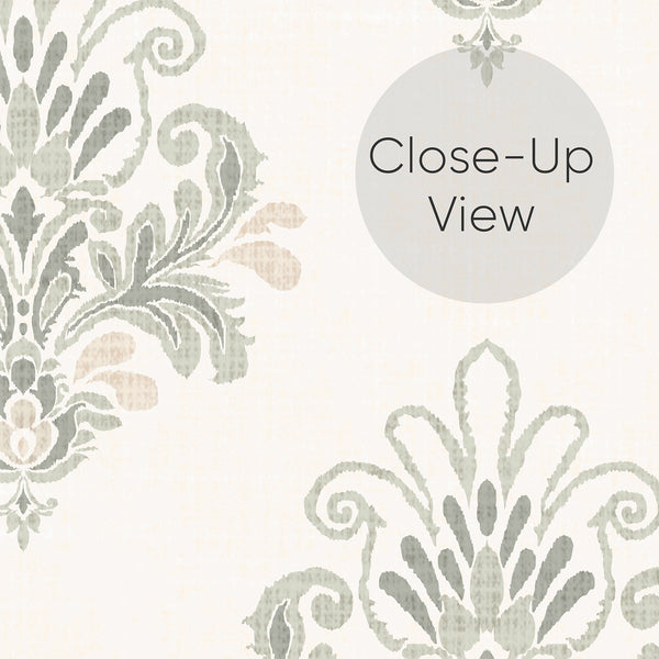 Close up of soft sage green and beige wallpaper with decorative damask motifs and delicate textured details, perfect for a French country bedroom or living room.