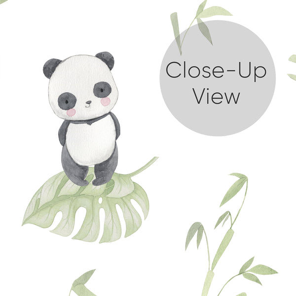 Close up of kids room wallpaper featuring an adorable watercolor panda with rosy cheeks, soft green botanical leaves and delicate bamboo on a white background.