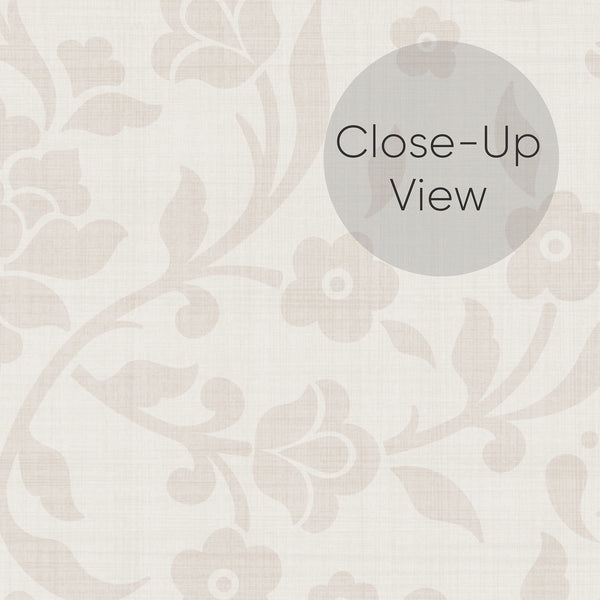 Close up of cream and beige peel and stick damask wallpaper featuring a delicate tonal floral pattern with stylized blossoms and graceful vines on a textured background.