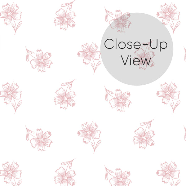 Close up of pink and white floral wallpaper with a simple repeating pattern of delicate hand drawn flowers, perfect for a soft feminine nursery or girls bedroom.
