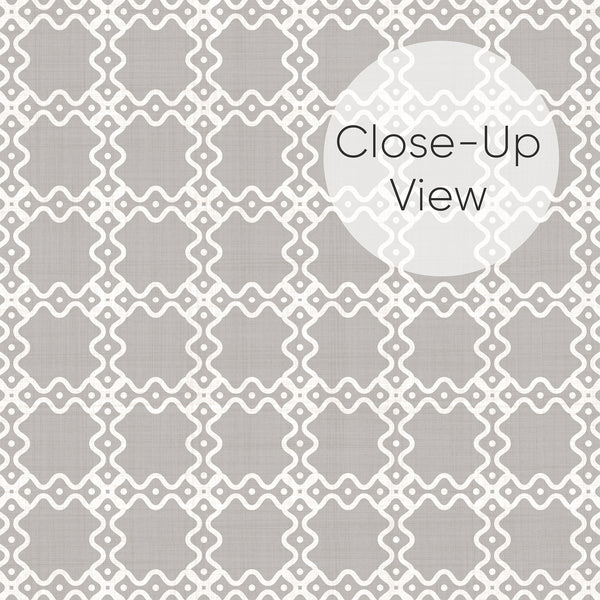 Close up of gray and white geometric wallpaper with an elegant repeating lattice pattern, ideal for a bedroom accent wall, living room or stylish home office.