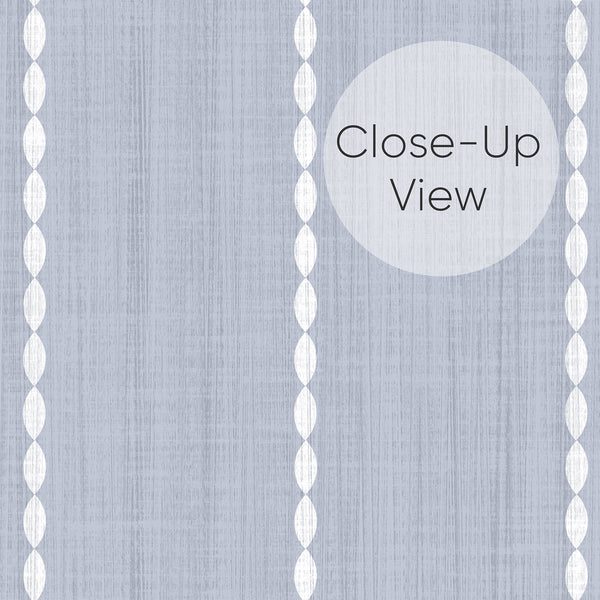 Close up of vintage-inspired blue gray wallpaper featuring delicate white geometric oval stripes and subtle vertical distressed texture for bedroom accent wall decor.