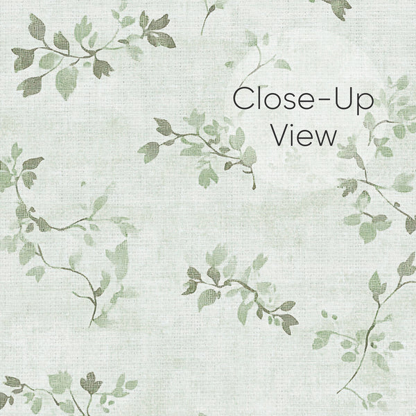 Sage green floral vine wallpaper with delicate vine sprigs scattered over a pale, linen-effect ground. The petite scale creates a cozy, vintage-inspired look, ideal for bedrooms or dining rooms. This pre-pasted wallpaper offers easy installation and is perfect for decorators seeking a soft, airy botanical design.