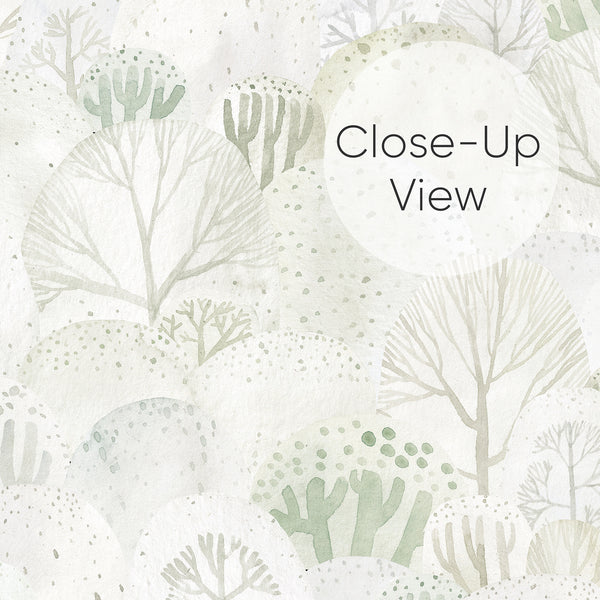 Close up of Light sage green peel and stick wallpaper featuring stylized forest trees, soft watercolor textures and subtle botanical details on an off-white background.