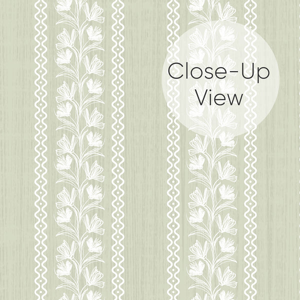 Close up of removable sage green wallpaper with vertical floral stripes, elegant botanical vines, and a vintage-inspired design for bedroom accent walls and nurseries.