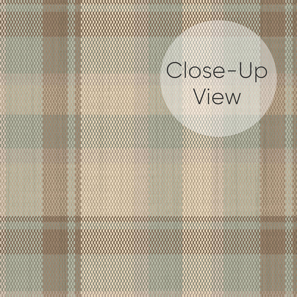 Close up of neutral beige plaid wallpaper with muted brown, taupe, and sage green checks, creating a cozy rustic look for bedroom accent walls and living room decor.