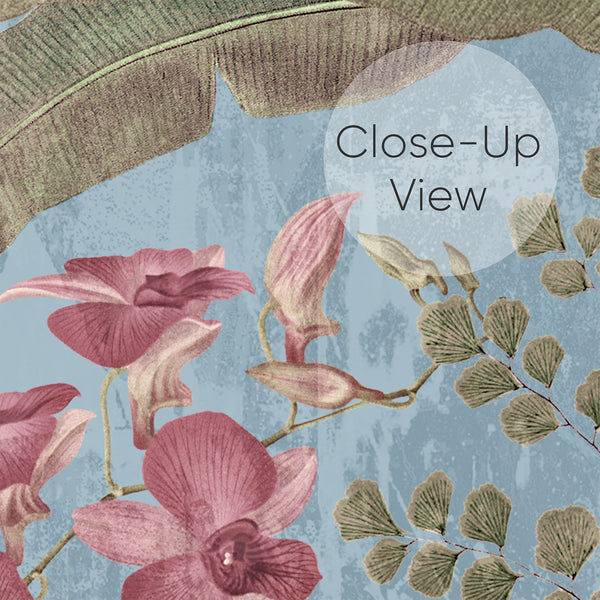 Close up of blue wallpaper featuring colorful parrots surrounded by lush green tropical leaves, delicate ferns and dusty pink botanical flowers.