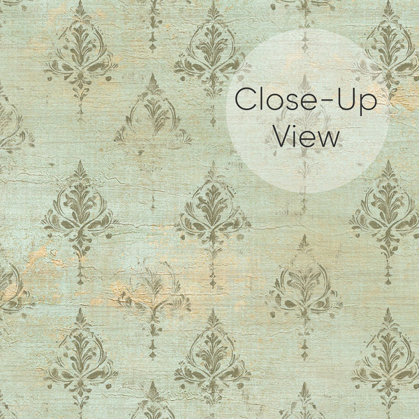 Close up of distressed green damask wallpaper with repeating ornamental motifs and warm beige accents, ideal for a bedroom, living room or dining room accent wall.