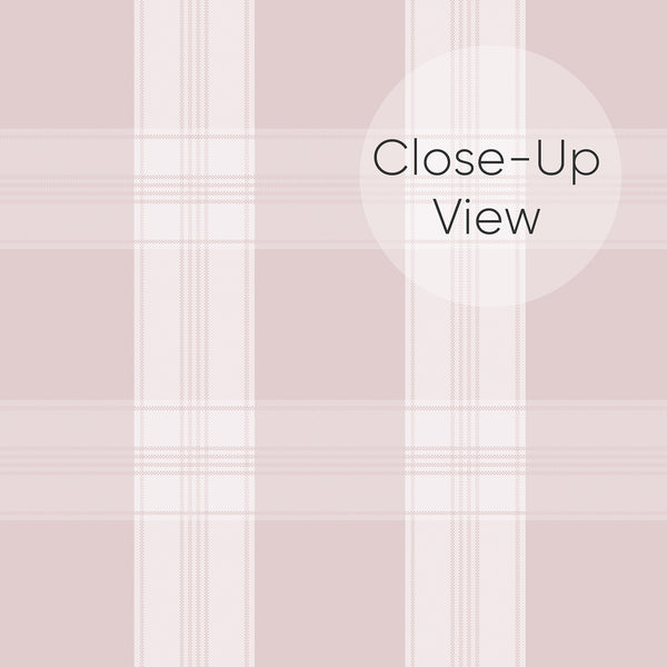 Close up of removable wallpaper in blush pink and ivory with a classic plaid pattern and fine vertical and horizontal lines for a bedroom accent wall.