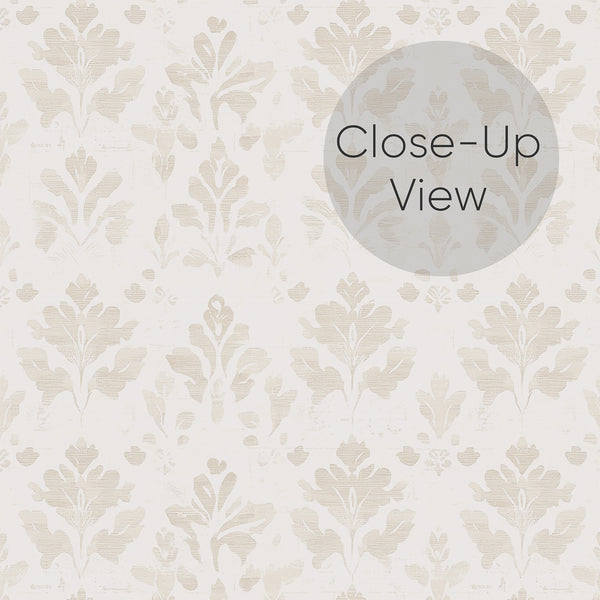 Close up of damask style vintage beige floral wallpaper featuring repeating botanical motifs and a weathered textured effect, perfect for neutral bedroom and living room decor.