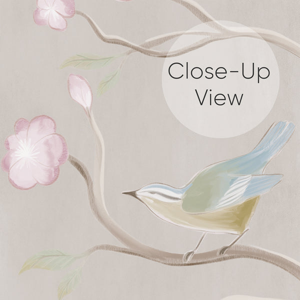 Close up of chinoiserie bird wallpaper featuring white herons among flowering trees, soft green grasses and delicate pastel blossoms for an elegant bedroom wall.