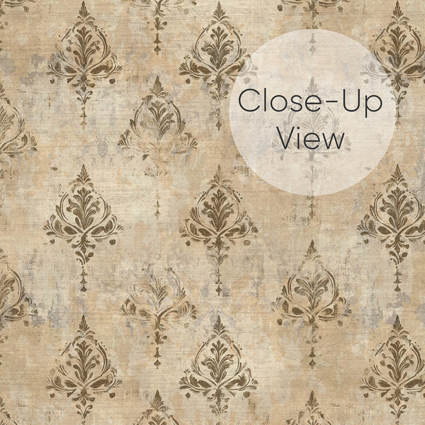 Close up of distressed beige and brown damask wallpaper with faded ornamental motifs and an aged texture, ideal for a bedroom, dining room or living room.