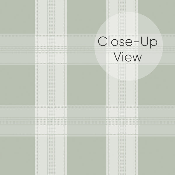 Close up view of soft green checkered wallpaper with muted sage squares and subtle woven-style lines for bedroom accent walls, nurseries, and cozy living spaces.