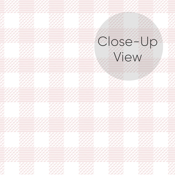 Close up of pink gingham wallpaper featuring a woven-style check pattern in soft blush and white for a charming farmhouse nursery or girls bedroom.