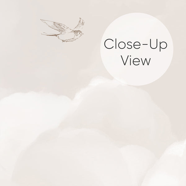 Close up of dreamy cloud wall mural in warm beige and soft white with delicate birds flying through the sky, designed for a peaceful neutral nursery interior.