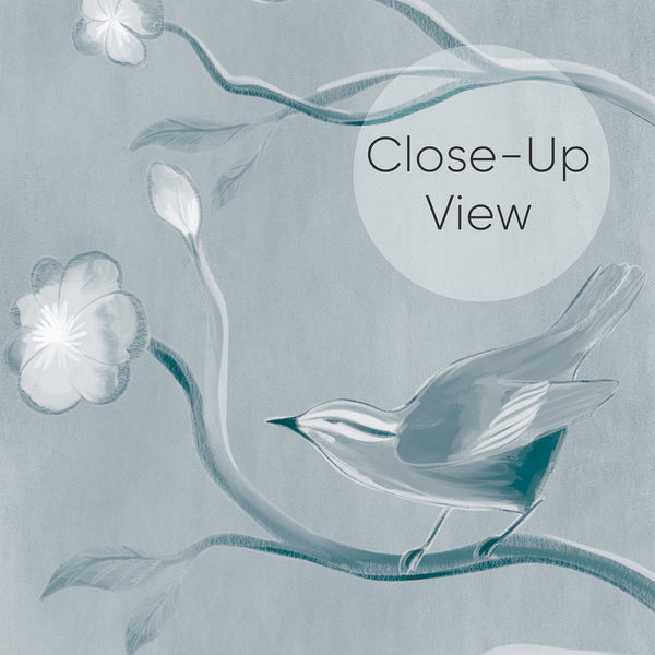 Close up of Watercolor bird wallpaper in soft blue with herons, flowering trees, butterflies and delicate plants for an elegant bedroom accent wall.
