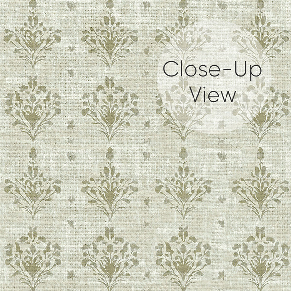 Close up of vintage sage green damask wallpaper with distressed floral motifs on a light neutral background, ideal for bedroom, dining room or living room walls.