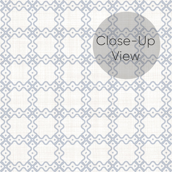 Modern geometric wallpaper featuring dusty blue interlocking shapes on a warm white background for a bedroom, home office or living room.