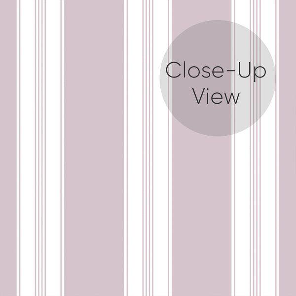 Close up of Removable wallpaper in dusty mauve and white with alternating broad stripes and narrow pinstripe details for a modern bedroom accent wall.