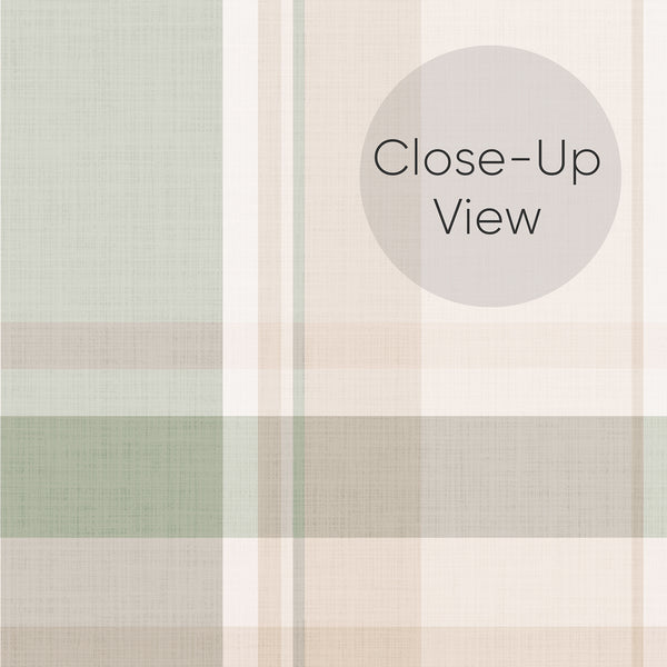 Close up of cottagecore plaid peel and stick wallpaper in muted sage green and beige with a classic tartan pattern, perfect for a charming bedroom accent wall.